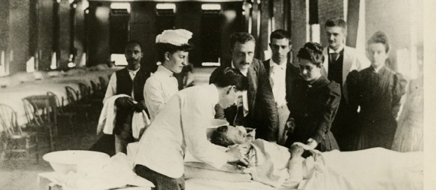 Patient receiving eye treatment, 1902.png